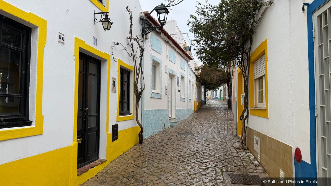 Wet cobbled streets in Ferragudo village in the rain, Algarve