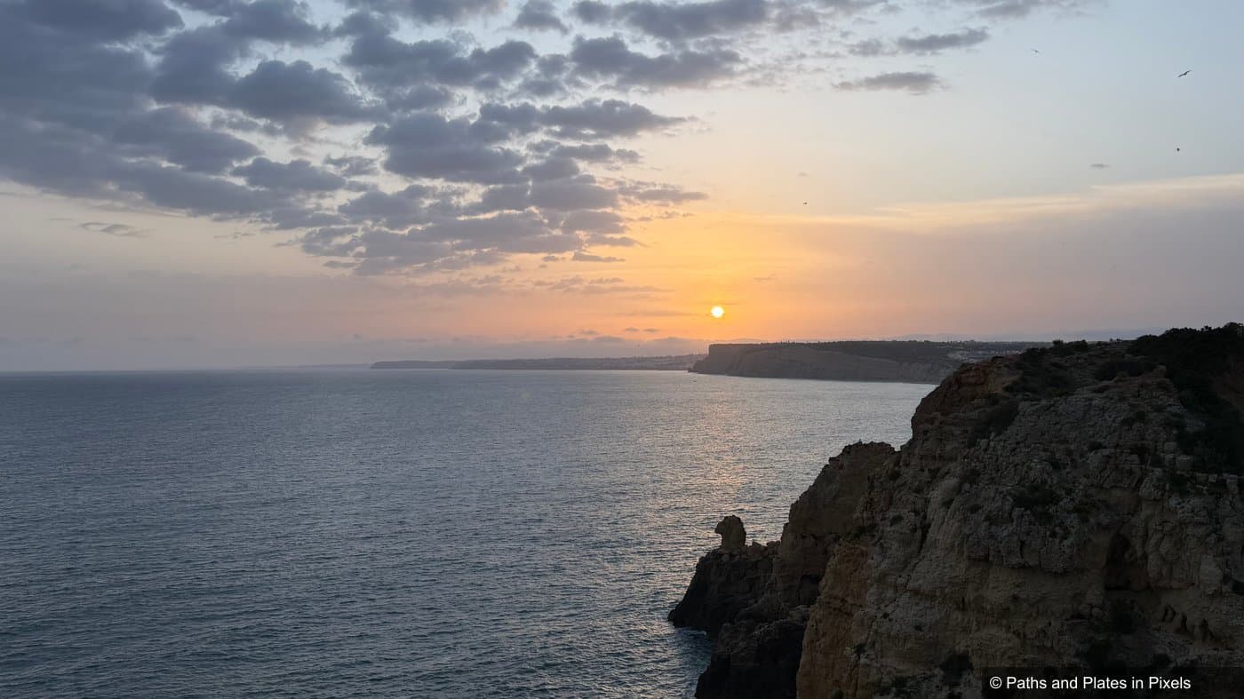 Sunset silhouette over the cliffs at Ponta da Piedade, Lagos