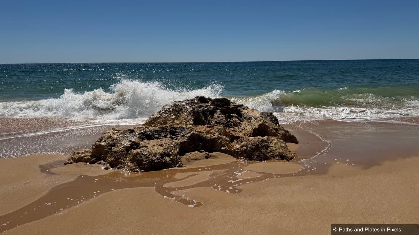 Praia da Galé beach, wide sandy beach with calm waves, Algarve